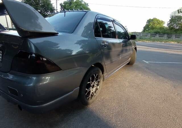 Сірий Міцубісі Lancer, об'ємом двигуна 1.6 л та пробігом 230 тис. км за 3950 $, фото 21 на Automoto.ua