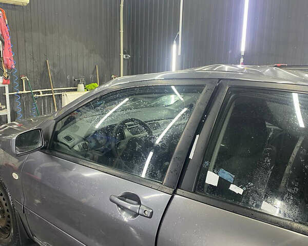 Серый Мицубиси Лансер, объемом двигателя 1.6 л и пробегом 100 тыс. км за 2500 $, фото 3 на Automoto.ua