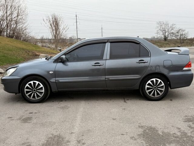 Сірий Міцубісі Lancer, об'ємом двигуна 1.6 л та пробігом 270 тис. км за 4300 $, фото 3 на Automoto.ua
