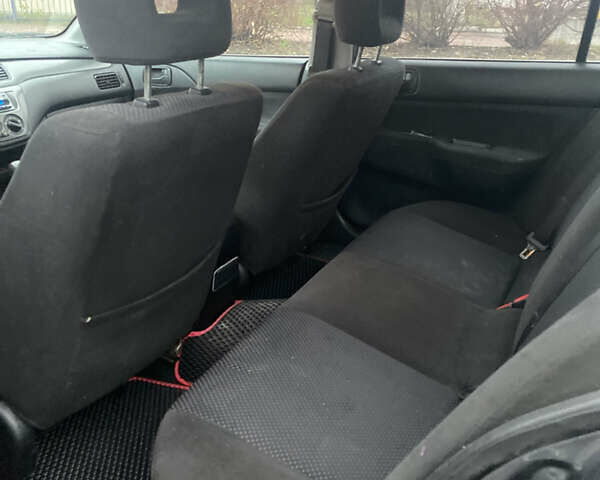 Серый Мицубиси Лансер, объемом двигателя 1.6 л и пробегом 346 тыс. км за 4299 $, фото 5 на Automoto.ua