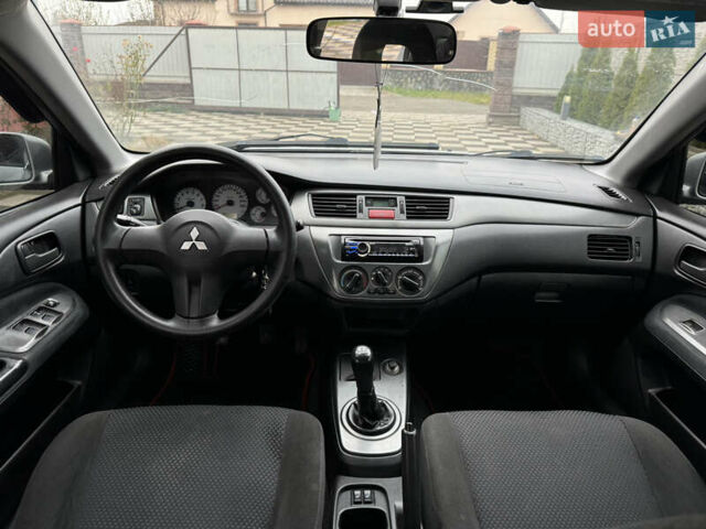 Сірий Міцубісі Lancer, об'ємом двигуна 1.6 л та пробігом 281 тис. км за 3999 $, фото 18 на Automoto.ua