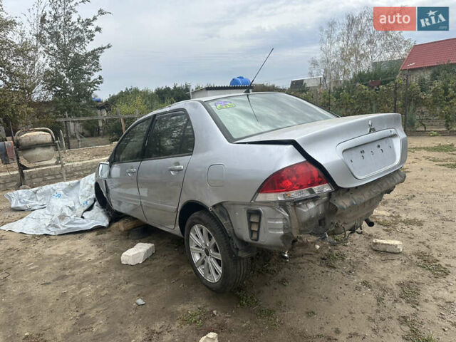 Сірий Міцубісі Lancer, об'ємом двигуна 1.58 л та пробігом 210 тис. км за 1300 $, фото 3 на Automoto.ua