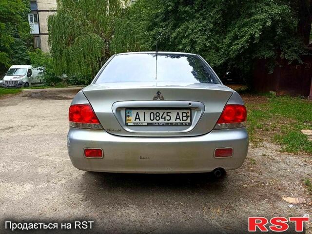 Серый Мицубиси Лансер, объемом двигателя 1.6 л и пробегом 160 тыс. км за 3800 $, фото 2 на Automoto.ua