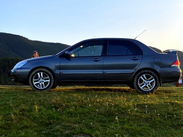 Сірий Міцубісі Lancer, об'ємом двигуна 1.6 л та пробігом 240 тис. км за 4450 $, фото 4 на Automoto.ua