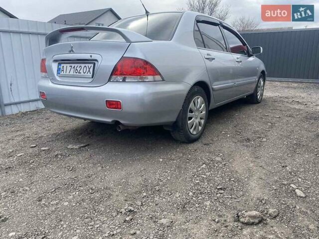 Сірий Міцубісі Lancer, об'ємом двигуна 1.6 л та пробігом 238 тис. км за 5500 $, фото 4 на Automoto.ua