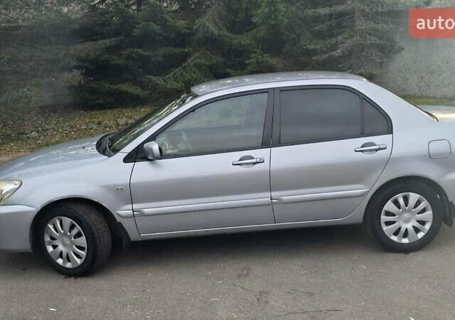 Сірий Міцубісі Lancer, об'ємом двигуна 1.6 л та пробігом 213 тис. км за 3600 $, фото 10 на Automoto.ua