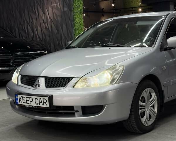 Серый Мицубиси Лансер, объемом двигателя 1.58 л и пробегом 271 тыс. км за 4200 $, фото 9 на Automoto.ua