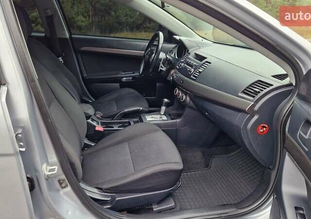 Серый Мицубиси Лансер, объемом двигателя 2 л и пробегом 213 тыс. км за 6550 $, фото 18 на Automoto.ua