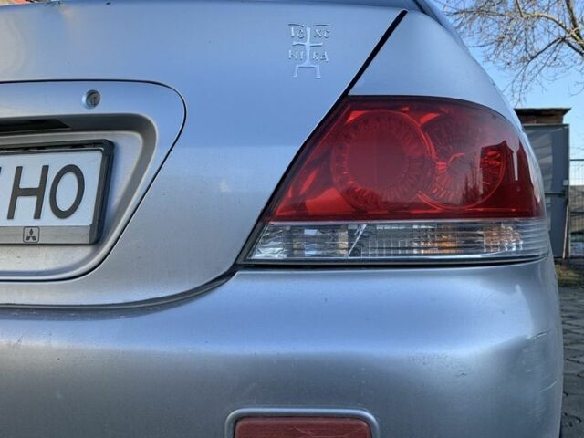 Сірий Міцубісі Lancer, об'ємом двигуна 1.6 л та пробігом 248 тис. км за 3000 $, фото 6 на Automoto.ua