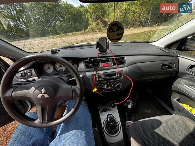 Серый Мицубиси Лансер, объемом двигателя 1.6 л и пробегом 222 тыс. км за 5300 $, фото 12 на Automoto.ua