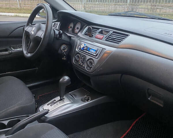 Серый Мицубиси Лансер, объемом двигателя 1.6 л и пробегом 346 тыс. км за 4299 $, фото 11 на Automoto.ua