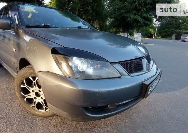 Сірий Міцубісі Lancer, об'ємом двигуна 1.6 л та пробігом 230 тис. км за 3950 $, фото 1 на Automoto.ua