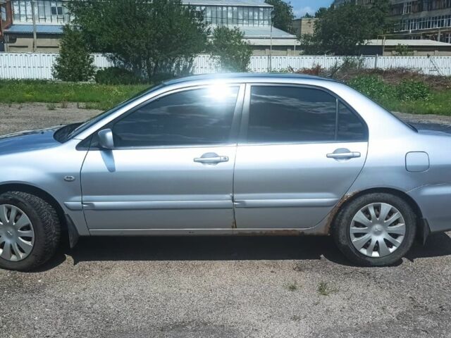 Сірий Міцубісі Lancer, об'ємом двигуна 1.6 л та пробігом 274 тис. км за 3200 $, фото 2 на Automoto.ua