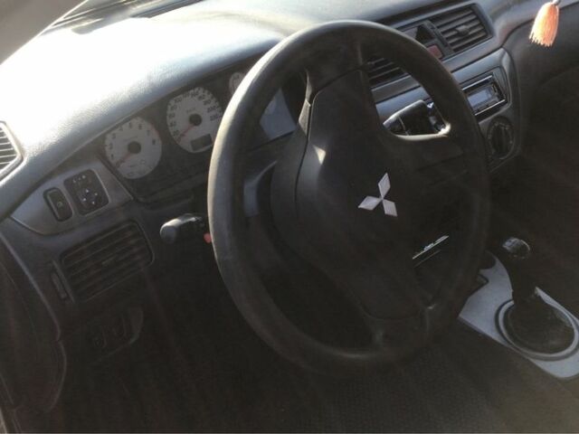 Серый Мицубиси Лансер, объемом двигателя 1.5 л и пробегом 269 тыс. км за 4200 $, фото 6 на Automoto.ua