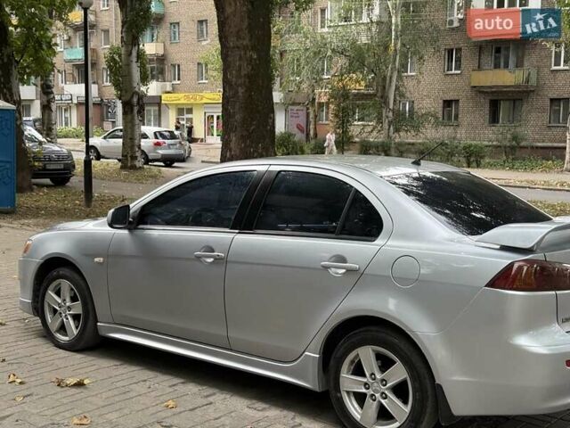 Серый Мицубиси Лансер, объемом двигателя 2 л и пробегом 187 тыс. км за 5950 $, фото 1 на Automoto.ua