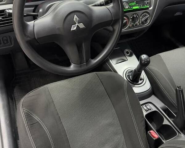 Серый Мицубиси Лансер, объемом двигателя 1.58 л и пробегом 271 тыс. км за 4200 $, фото 18 на Automoto.ua