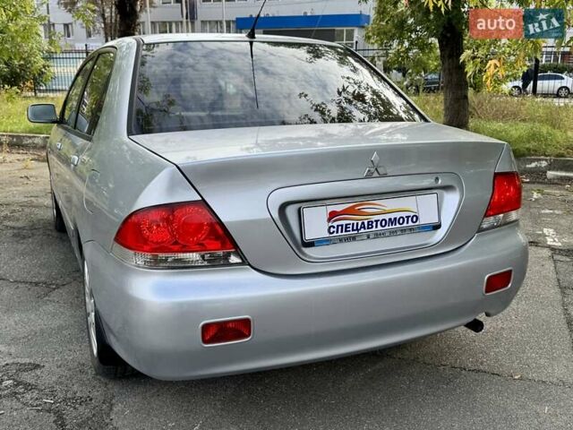 Сірий Міцубісі Lancer, об'ємом двигуна 1.58 л та пробігом 138 тис. км за 4990 $, фото 10 на Automoto.ua