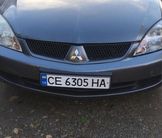 Серый Мицубиси Лансер, объемом двигателя 1.5 л и пробегом 269 тыс. км за 4200 $, фото 7 на Automoto.ua