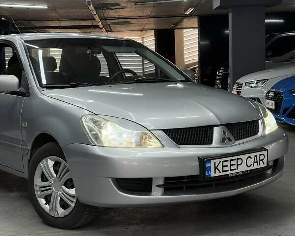 Серый Мицубиси Лансер, объемом двигателя 1.58 л и пробегом 271 тыс. км за 4200 $, фото 2 на Automoto.ua