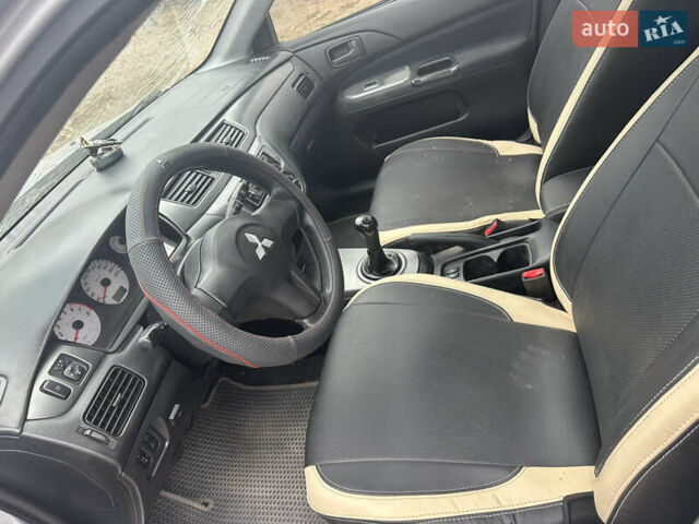 Сірий Міцубісі Lancer, об'ємом двигуна 1.58 л та пробігом 210 тис. км за 1300 $, фото 2 на Automoto.ua