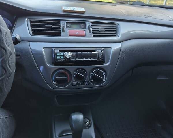 Сірий Міцубісі Lancer, об'ємом двигуна 1.58 л та пробігом 235 тис. км за 5200 $, фото 11 на Automoto.ua