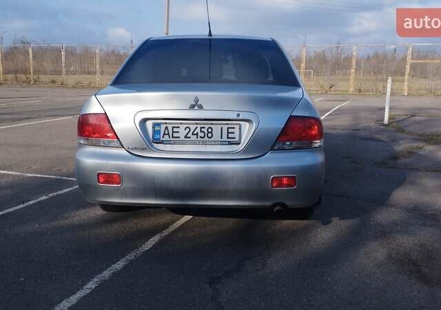 Серый Мицубиси Лансер, объемом двигателя 1.6 л и пробегом 205 тыс. км за 4500 $, фото 3 на Automoto.ua
