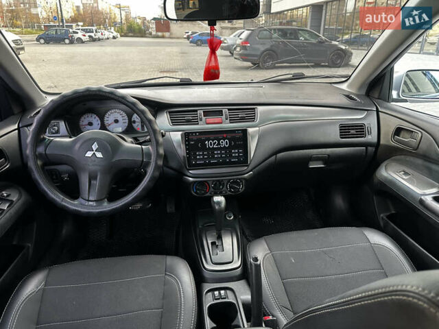 Серый Мицубиси Лансер, объемом двигателя 1.6 л и пробегом 200 тыс. км за 3900 $, фото 9 на Automoto.ua