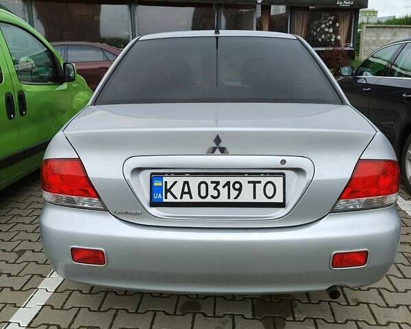 Сірий Міцубісі Lancer, об'ємом двигуна 1.58 л та пробігом 168 тис. км за 5700 $, фото 1 на Automoto.ua