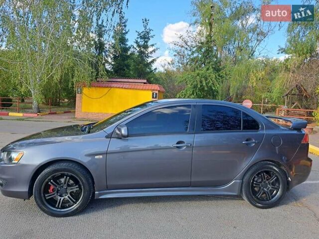 Серый Мицубиси Лансер, объемом двигателя 2 л и пробегом 215 тыс. км за 7300 $, фото 16 на Automoto.ua