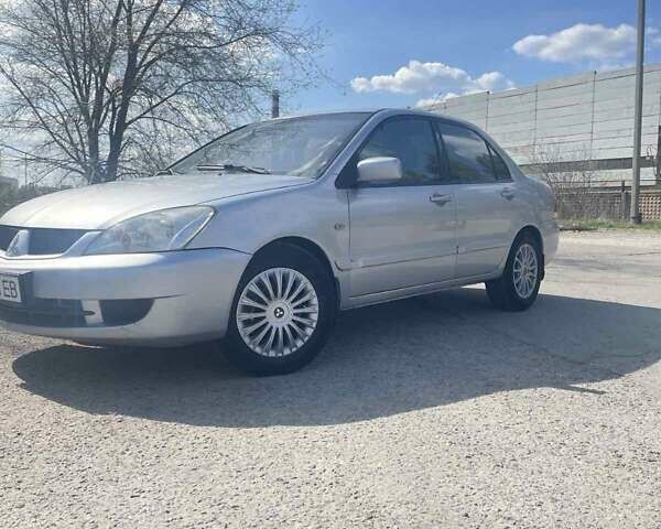 Сірий Міцубісі Lancer, об'ємом двигуна 1.58 л та пробігом 248 тис. км за 4999 $, фото 4 на Automoto.ua