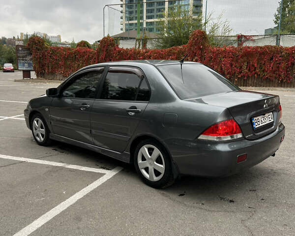 Сірий Міцубісі Lancer, об'ємом двигуна 1.58 л та пробігом 176 тис. км за 4700 $, фото 4 на Automoto.ua