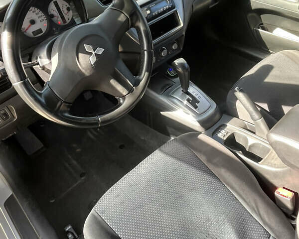 Сірий Міцубісі Lancer, об'ємом двигуна 1.58 л та пробігом 212 тис. км за 5600 $, фото 4 на Automoto.ua