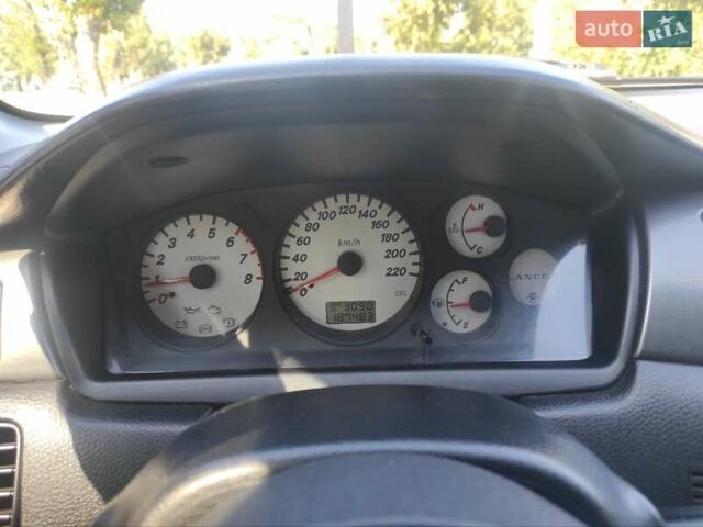 Серый Мицубиси Лансер, объемом двигателя 1.6 л и пробегом 187 тыс. км за 4500 $, фото 10 на Automoto.ua