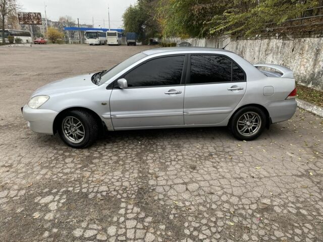 Серый Мицубиси Лансер, объемом двигателя 1.6 л и пробегом 380 тыс. км за 4000 $, фото 1 на Automoto.ua