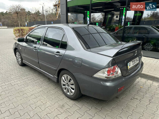 Сірий Міцубісі Lancer, об'ємом двигуна 1.6 л та пробігом 115 тис. км за 2800 $, фото 2 на Automoto.ua