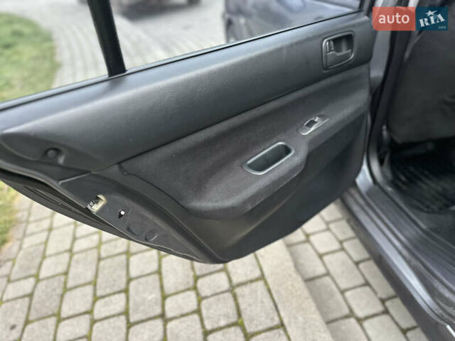 Сірий Міцубісі Lancer, об'ємом двигуна 1.6 л та пробігом 177 тис. км за 2800 $, фото 26 на Automoto.ua