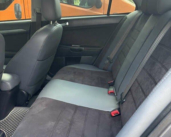 Сірий Міцубісі Lancer, об'ємом двигуна 2 л та пробігом 298 тис. км за 5600 $, фото 8 на Automoto.ua