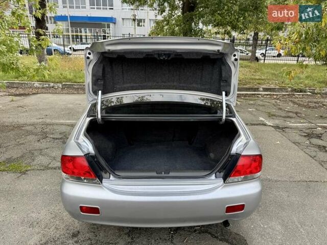 Сірий Міцубісі Lancer, об'ємом двигуна 1.58 л та пробігом 138 тис. км за 4990 $, фото 33 на Automoto.ua