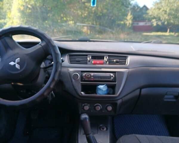 Серый Мицубиси Лансер, объемом двигателя 1.58 л и пробегом 300 тыс. км за 4400 $, фото 6 на Automoto.ua