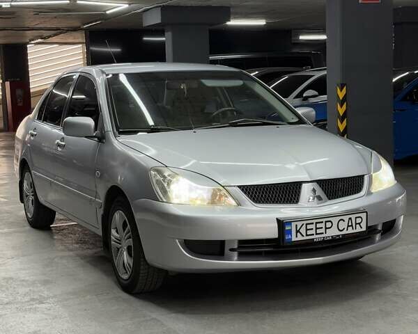 Серый Мицубиси Лансер, объемом двигателя 1.58 л и пробегом 271 тыс. км за 4200 $, фото 4 на Automoto.ua