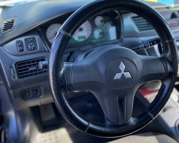 Сірий Міцубісі Lancer, об'ємом двигуна 1.6 л та пробігом 293 тис. км за 5000 $, фото 9 на Automoto.ua