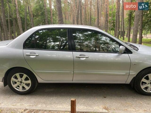 Серый Мицубиси Лансер, объемом двигателя 1.59 л и пробегом 220 тыс. км за 6500 $, фото 5 на Automoto.ua