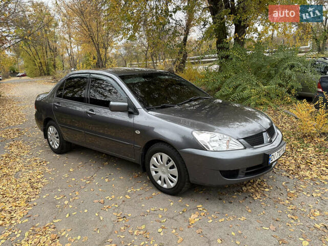Сірий Міцубісі Lancer, об'ємом двигуна 1.58 л та пробігом 247 тис. км за 4900 $, фото 3 на Automoto.ua
