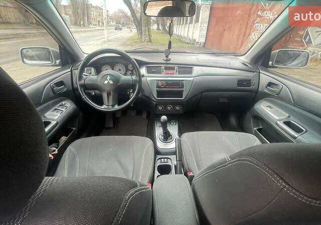 Серый Мицубиси Лансер, объемом двигателя 2 л и пробегом 230 тыс. км за 4000 $, фото 7 на Automoto.ua