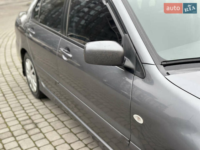Сірий Міцубісі Lancer, об'ємом двигуна 1.6 л та пробігом 177 тис. км за 2800 $, фото 13 на Automoto.ua