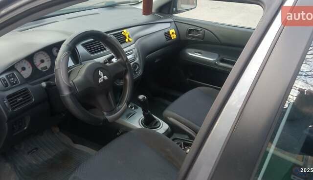 Міцубісі Lancer 2007 у Хмельницькому на Automoto.ua Сірий Міцубісі Lancer, об'ємом двигуна 1.58 л та пробігом 143 тис. км за 4100 $, фото 6 на Automoto.ua