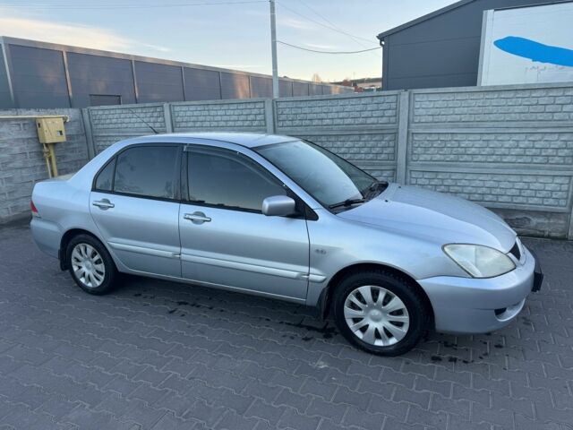 Серый Мицубиси Лансер, объемом двигателя 1.6 л и пробегом 256 тыс. км за 4500 $, фото 1 на Automoto.ua