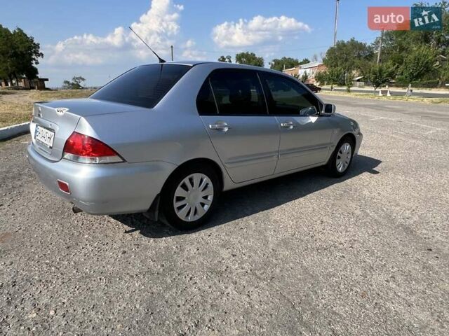 Сірий Міцубісі Lancer, об'ємом двигуна 1.6 л та пробігом 283 тис. км за 4900 $, фото 6 на Automoto.ua