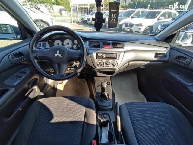 Сірий Міцубісі Lancer, об'ємом двигуна 1.6 л та пробігом 222 тис. км за 3990 $, фото 23 на Automoto.ua