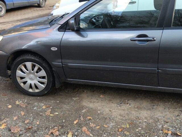 Серый Мицубиси Лансер, объемом двигателя 1.5 л и пробегом 269 тыс. км за 4200 $, фото 20 на Automoto.ua